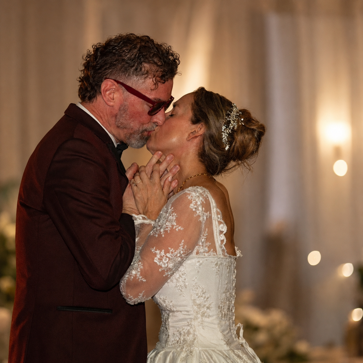 Bride and groom sharing a kiss at their elegant wedding reception